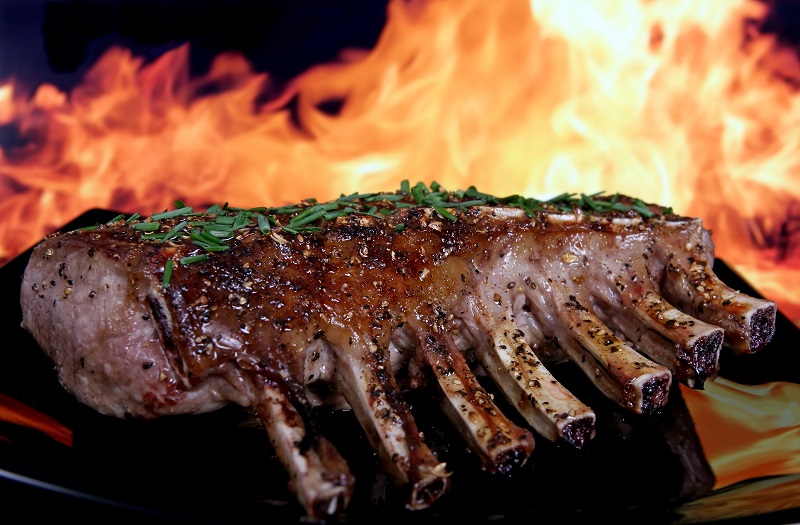 Silhouette of summer garden BBQ isolated against fire